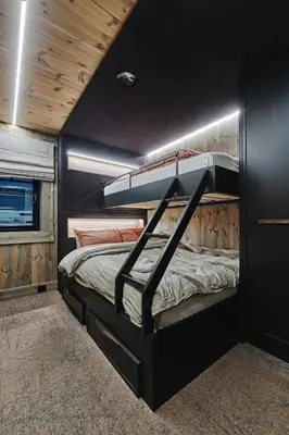 a bedroom with two bunk beds in a trailer at Luxury Cabin With Views in Stranda