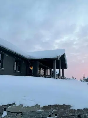 a building with a snow covered roof at Modern Cabin With Views Of Skeikampen in Svingvoll
