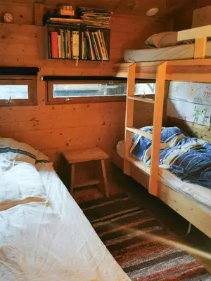 a bedroom with two bunk beds in a cabin at Ål Cabin With Panoramic Views in Favang