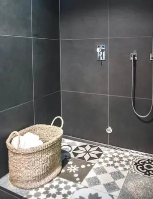 a bathroom with a basket on the floor of a shower at Authentic Cabin Hygge All Year Round At Hafjell in Øyer