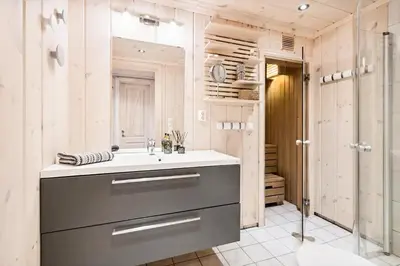 a bathroom with a sink and a shower at Relax By The Ski Tracks In A Cabin At Sjusjøen in Sjusjøen