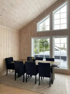 a dining room with a table and chairs at Relax By The Ski Tracks In A Cabin At Sjusjøen in Sjusjøen