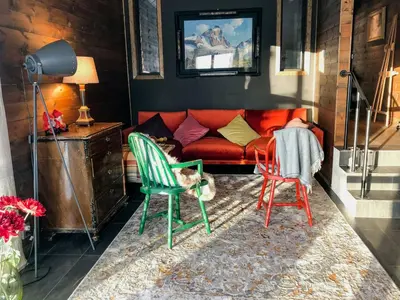 a living room with two chairs and a couch at Cozy Holiday Home Embraced By Valdres Hills in Vang I Valdres