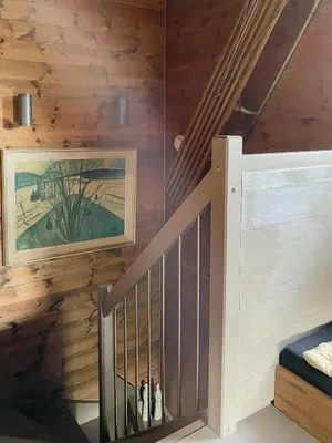 a staircase in a cabin with wood paneling at Cozy Holiday Home Embraced By Valdres Hills in Vang I Valdres