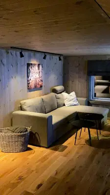 a large bed in a room with a table at Modern Cabin In Trysil With Mountain Views in Trysil