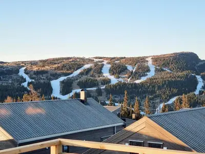 a view from the roof of a house with a ski slope at Stylish Modern Cabin In Charming Kvitfjell in Favang