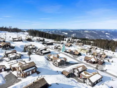 an aerial view of a village in the snow at Modern And Spacious Cabin At Mosetertoppen in Øyer