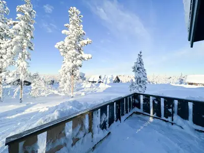 a snow covered yard with snow covered trees at Mountain Cabin With Panoramic View In Nesbyen in Nesbyen