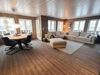 a living room with a couch and a table at Mountain Cabin With Panoramic View In Nesbyen in Nesbyen