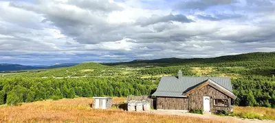an old house on a hill with a view at Simple Cabin Life In This Nature Cabin in Uvdal