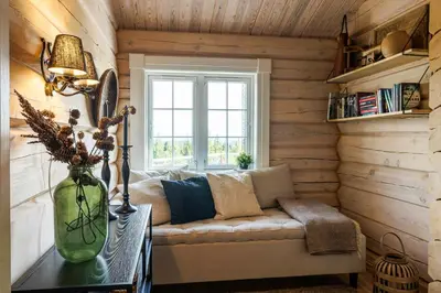 a living room with a couch and a window at Cozy And Spacious Family Cabin In Valdres in Bagn