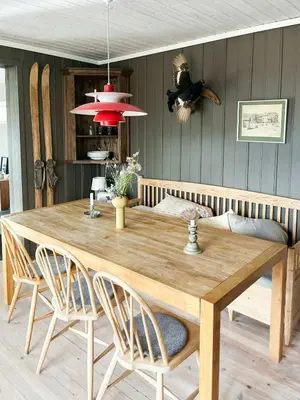 a dining room table with two chairs and a dining room at Cabin With Mountain View Near Lake Totak in Rauland