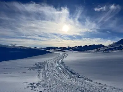 a road in the middle of a snow covered field at Modern Cabin With View In Rauland in Rauland