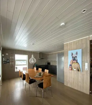 a dining room with a wooden table and chairs at Enjoy Family Time In Beautiful Nature in Krøderen