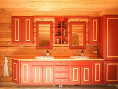 a bathroom with two sinks in a log cabin at Cabin With Wooden Interior By Lake Tinnsjøen in Atra