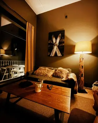 a living room with a couch and a coffee table at Modern Flat In Trysil Alpine Lodge in Trysil