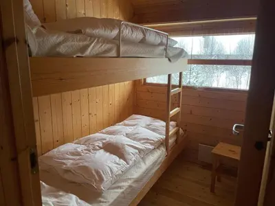 a room with two bunk beds in a cabin at Relaxing Mountain Cabin With Panoramic Views in Beitostøl