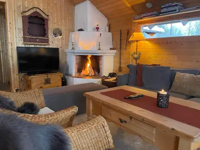 a living room with a couch and a fireplace at Relaxing Mountain Cabin With Panoramic Views in Beitostøl