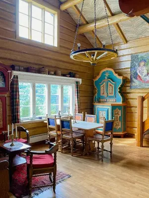 a dining room with a table and chairs at Fantastic Charming Cabin By Tinnsjøen in Austbygdi