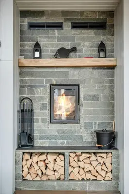 a brick fireplace with a fire in it at High-Standard Cabin In Beautiful Rauland in Rauland