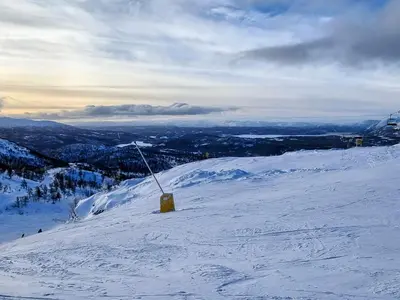 a snow covered mountain with a yellow box on it at 9 person holiday home in Rauland in Rauland