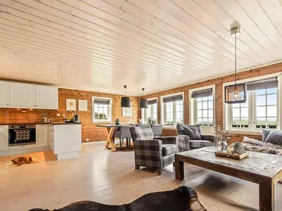 a living room with a couch and a table at 9 person holiday home in Rauland in Rauland