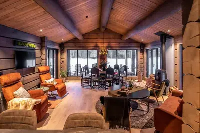 a living room filled with furniture and a dining room at Cabin With Great Fishing At Trysilfjellet in Jordet