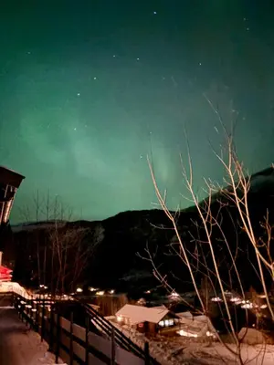 a night view of the stars in the sky over a city at A home away from home in Sogndal