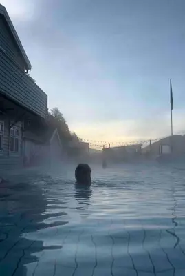 a person swimming in a body of water at In the heart of Bergen in Bergen