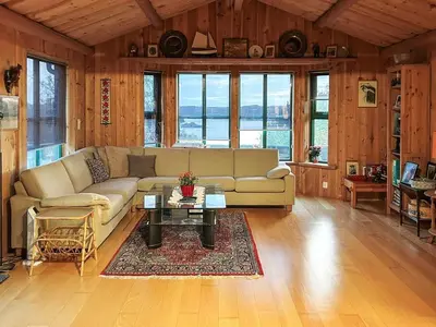 a living room with a couch and a table at 4 person holiday home in Kjerrgarden in Kjerrgarden