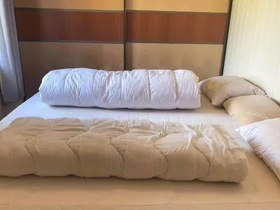 two pillows sitting on a bed in a bedroom at 4 person holiday home in Kjerrgarden in Kjerrgarden