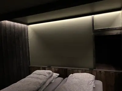 a room with two beds with towels on them at Cabin with large outdoor area in Hamar
