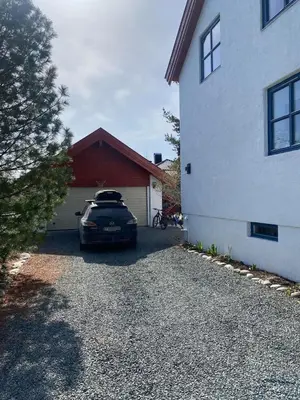 a car parked in the driveway of a house at SKI VM House 5 min walk to Granåsen ski stadion in Trondheim