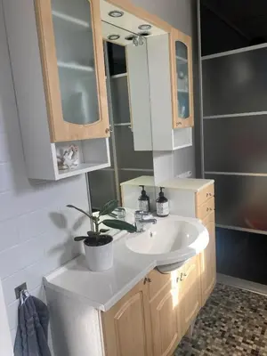 a bathroom with a white sink and a mirror at SKI VM House 5 min walk to Granåsen ski stadion in Trondheim