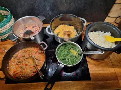 a group of pots of food on a stove at Lake view apartment in center of Bergen - 3 bedrooms in Bergen