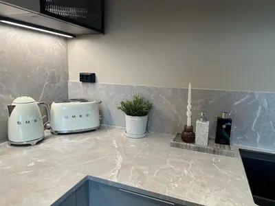 two toasters sitting on a counter in a kitchen at Delicate and new apartment in quiet surroundings in Trondheim