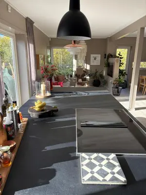 a kitchen with a black and white counter top at Modern & cozy house in Trondheim