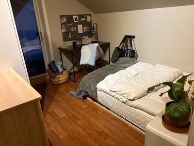 a bedroom with a bed and a desk with a chair at Modern & cozy house in Trondheim