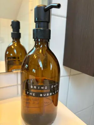 two bottles of alcohol are sitting on a counter at Modern & cozy house in Trondheim