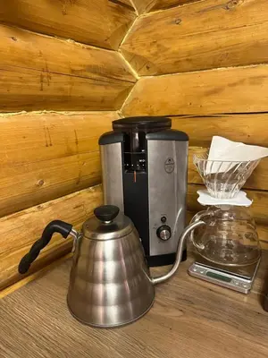 a coffee maker and a tea kettle on a counter at Chalet Skogshorn in Markegardlian