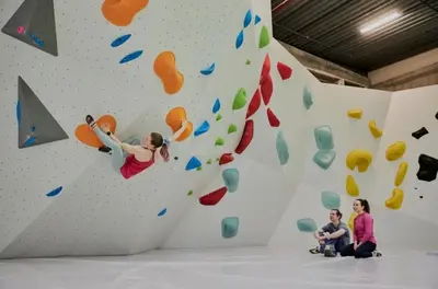 a woman is climbing a rock wall at Spacious house close to Ski World Championship in Trondheim