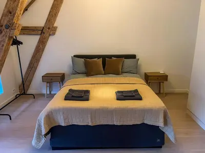 a bedroom with a bed with two pillows on it at MARINA LUXE - Two Bedrooms, High-End, Iconic Location & Private Parking in Ålesund