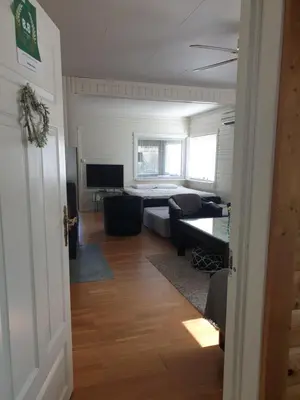 a living room with a couch and a television at Holiday Home Villa Gol in Gol