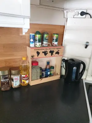 a kitchen counter with a organized pantry with spices at Holiday Home Villa Gol in Gol