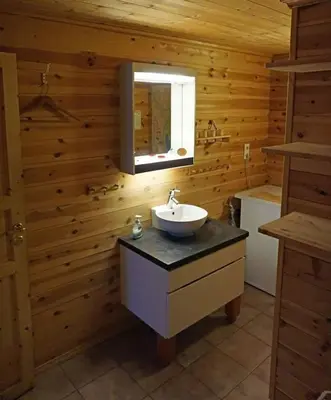 a bathroom with a sink and a mirror at Cozy cabin centrally located in Hovden in Hovden