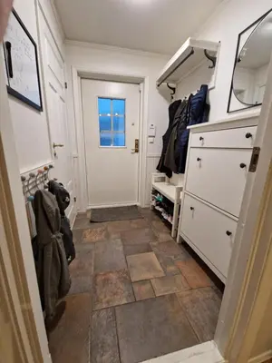 a small room with a door and a tiled floor at Granåsen World Championship Stay Walk to Ski Arena in Trondheim