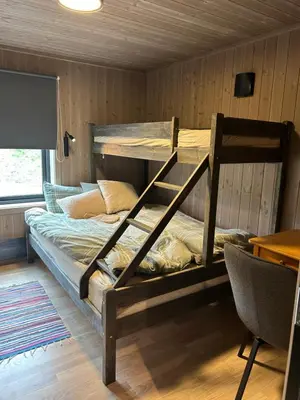 a bedroom with two bunk beds in a room at Eksklusiv hytte Musdalsseter in Mo
