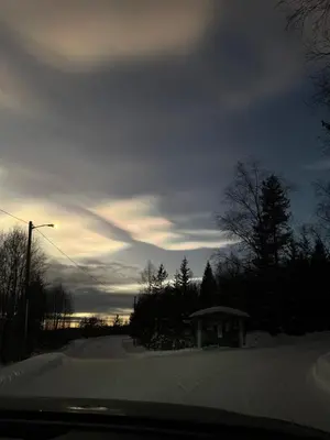 a view of a snow covered road with a sky at Peace in the heart of nature in Trysil