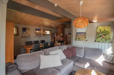 a living room with a couch and a table at Trysilfjellet Sør 17 in Trysil