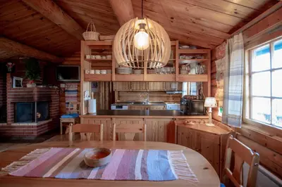 a kitchen with a table in a cabin at Trysilfjellet Sør 204 in Trysil